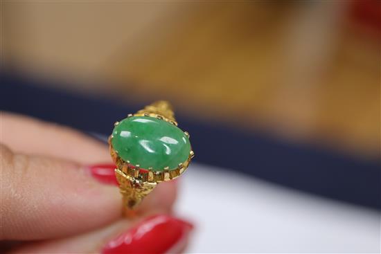 A Chinese yellow metal and jade ring, size L and a delicate gold mother of pearl and turquoise fringe necklace